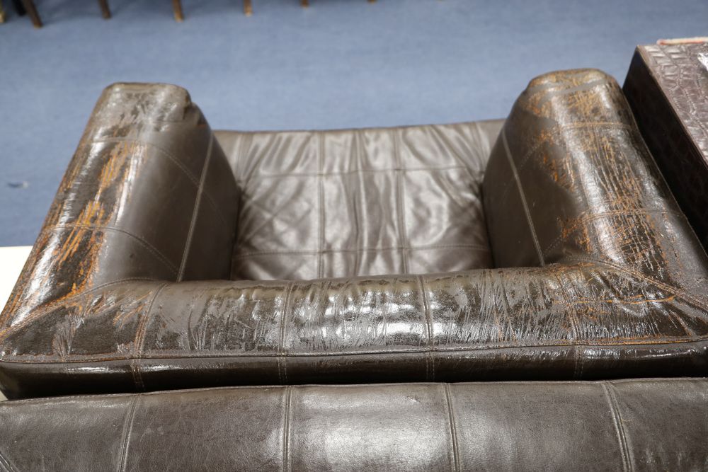 A pair of Andrew Martin brown leather armchairs, width 100cm depth 84cm height 70cm